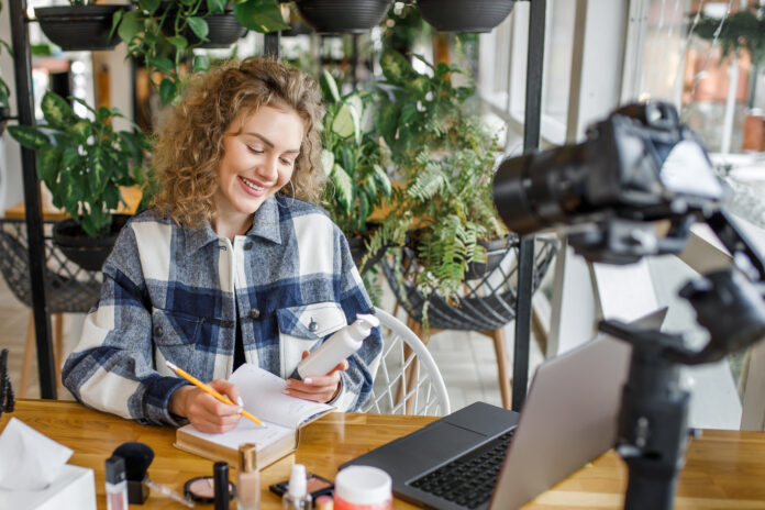 Pretty blonde woman, blogger and influencer testing new products